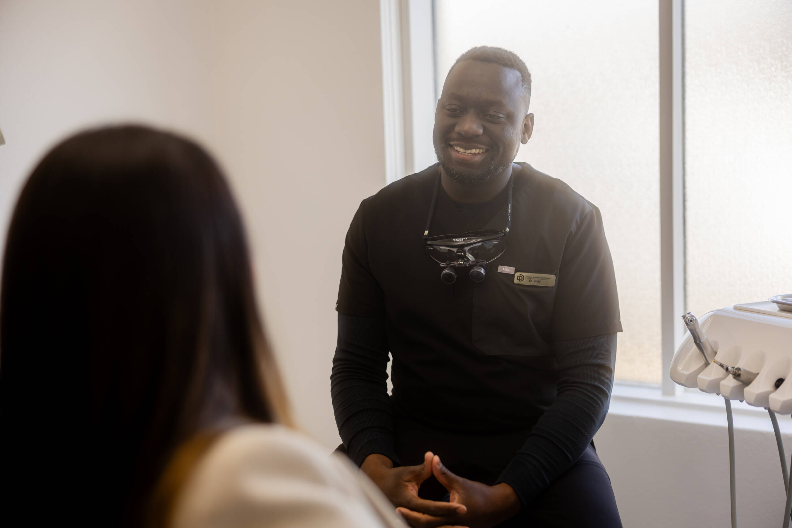 Dr Tendai with a patient at Dawson Street Dental