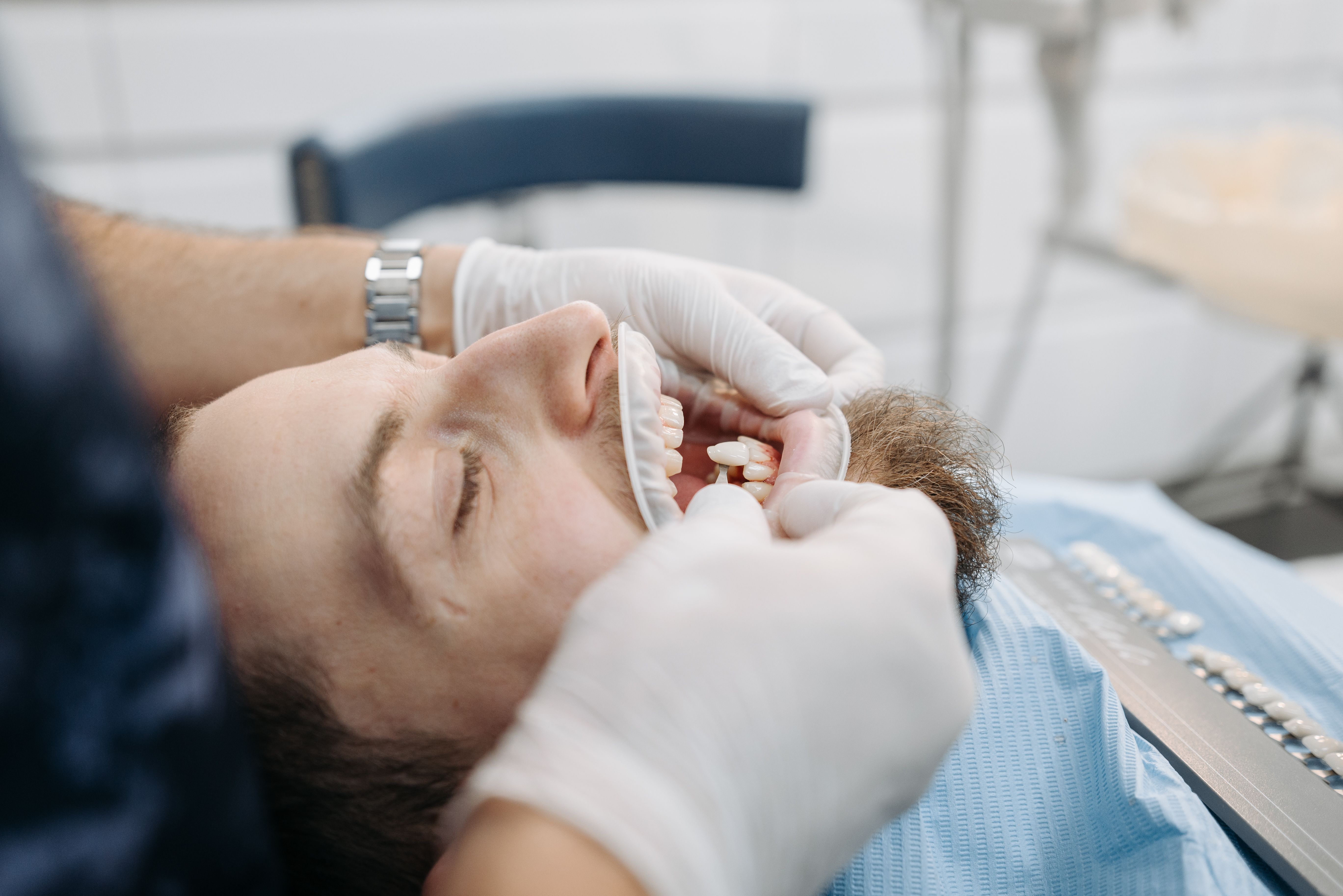 Dentist fitting custom dentures for a patient at Dawson Street Dental Surgery